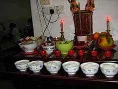Offering to ancestors on home altar: Public Domain