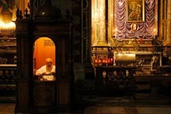 Catholic priest waits inside the confessional Source: http://www.flickr.com/photos/3059349393/3418857871/
