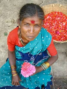 Indian flower seller with a tilak on her forehead