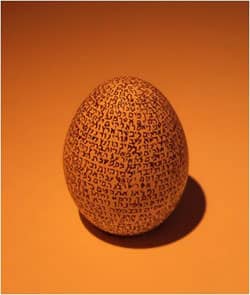 The first chapter of Bereshit on an egg at the Israel Museum via Wikimedia CC