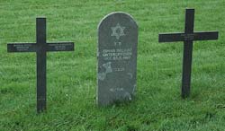 Title: Jewish tombstone between two Christian grave markers  Source: http://www.flickr.com/photos/ilesdelamadeleine/2555976376/