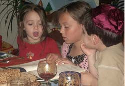 Title: Children read from the Haggadah during the seder Source: http://www.flickr.com/photos/bjohnson/447683884/in/set-72157600050549062/